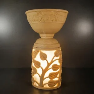 Sandstone Leaf Planter Light with glowing carved leaf pattern base
