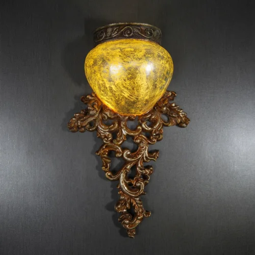 Antique Carved Wall Light with glowing amber shade and silver-brown finish