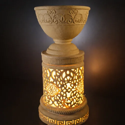 Sandstone Planter Light Stand with carved bowl and glowing lattice base