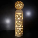 Sandstone Garden Pillar Light with carved floral pattern and glowing ball top