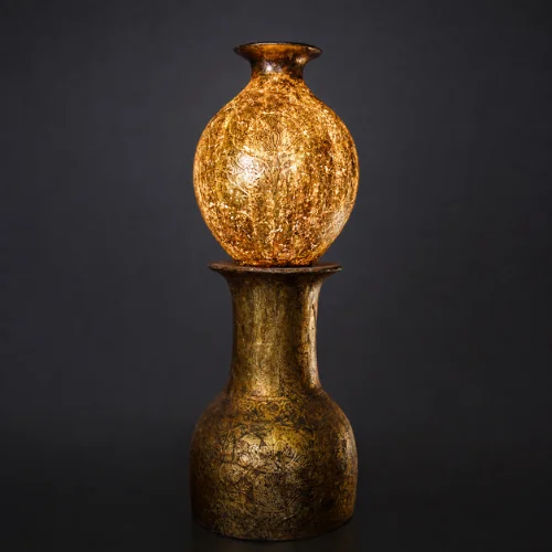 Golden Orb Pedestal Lamp with glowing sphere on antique base