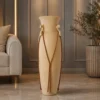 Tall handcrafted sandstone floor vase with twisted rope and scroll handles