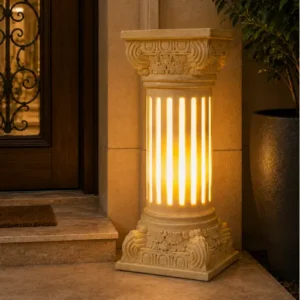 Add a graceful silhouette to your outdoor space with our sandstone garden light, a flared vase design finished with an elegant vine-carved body. Built to withstand the elements while adding timeless charm, this piece suits gardens, patios, walkways, and entryways beautifully. Flared Top Design Skilled artisans shape the crown of this sandstone garden light into a wide, gentle flare, inspired by classic vase silhouettes. The open, flowing top contrasts beautifully with the detailed carving below, giving the piece a graceful, balanced profile that draws the eye from a distance. Vine-Carved Column Body Flowing vines and delicate floral patterns wrap the cylindrical body of this sandstone garden light. Every leaf and petal is carved by hand, and once switched on, warm light glows softly through the detailed cutwork. The continuous vine pattern wraps around the column, creating a natural, garden-inspired look that reads beautifully by day and glows warmly by night. Glowing Fiber Illumination Inside the stone shell, a durable fiber lining delivers soft, even illumination. The fiber glows warmly through every carved detail, casting a gentle light across the surrounding space after sunset — perfect for creating a relaxed, welcoming outdoor atmosphere. Durable & Weather-Resistant Build Crafted from premium natural sandstone, this garden light is made to handle outdoor conditions year-round: - Washable — simply rinse with water to keep it looking fresh - Weatherproof — resists rain, sun, and seasonal wear - Sturdy construction — a tiered base keeps it stable outdoors - Low maintenance — no repainting or protective coating required With its flared vase top, hand-carved vine detailing, and warm glowing light, this sandstone garden light is a lasting addition to any outdoor setting.