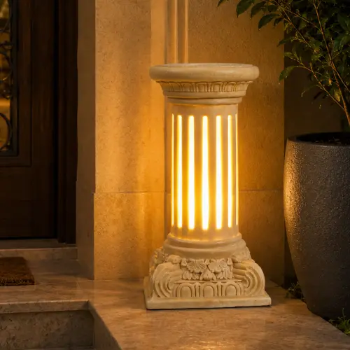 Sandstone fluted column garden light glowing warmly on a dark background