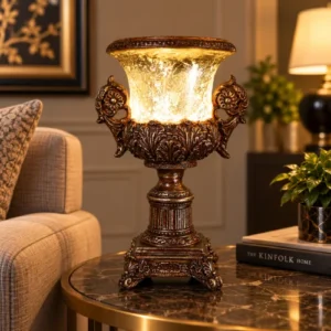 Ornate fiber glass pedestal lamp with glowing shade and floral details