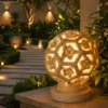 Sandstone Garden Light Ball with carved floral hexagon pattern