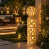 Sandstone Garden Pillar Light with carved floral pattern and glowing ball top