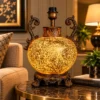 Ornate fiber glass table lamp with curved decorative handles