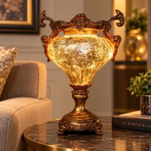 Ornate fiber glass decorative lamp with glowing body and pedestal base