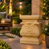 Sandstone carved leaf pedestal with scalloped urn top and stepped square base