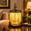 Ornate fiber glass lantern lamp with glowing cylindrical shade