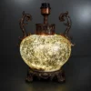 Ornate fiber glass table lamp with curved decorative handles