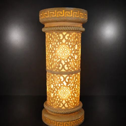 Faux sandstone double lantern pedestal with warm glowing light and intricate decorative pattern