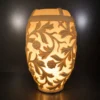 Illuminated sandstone planter and pot with floral carved design and fiberglass light section