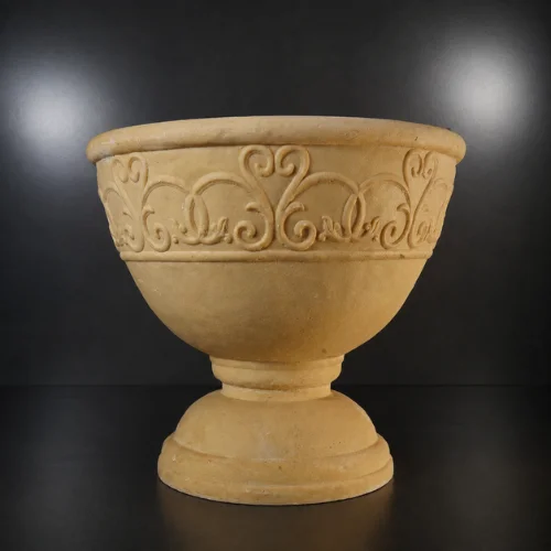 Decorative sandstone planter and pot with rounded bowl shape and floral detailing