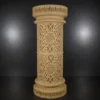 Faux sandstone double lantern pedestal with warm glowing light and intricate decorative pattern